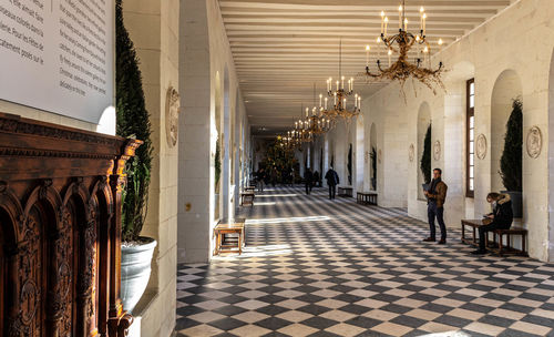 People in corridor of building