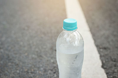 High angle view of drink in bottle on road