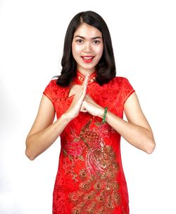 Portrait of a smiling young woman against white background
