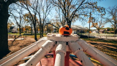 Halloween pumpkin on outdoor play equipment at playground