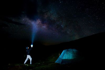 Low angle view of tent against sky at night