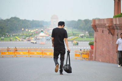 Full length rear view of a man