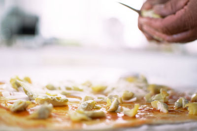 Close-up of person preparing food