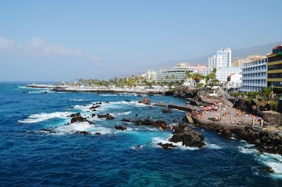 Scenic view of sea against blue sky