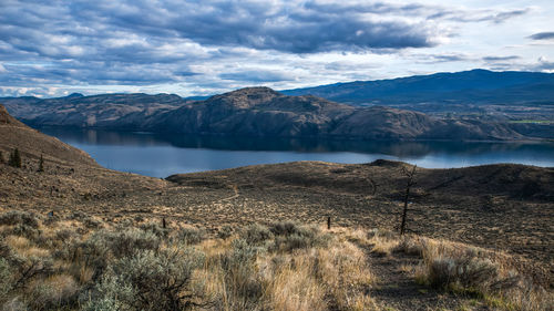 Scenic view of landscape and mountains against sky