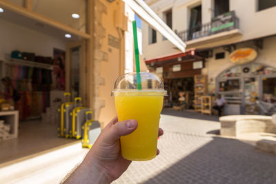 Close-up of hand holding drink