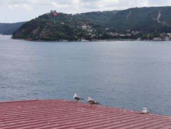 View of sea with mountain in background