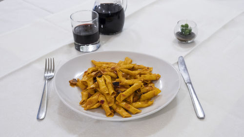 Dish of delicious garganelli pasta with bolognese sauce, italian cuisine