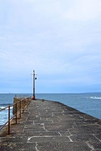 Pier on sea against sky