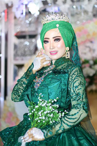 Portrait of smiling bride during wedding ceremony