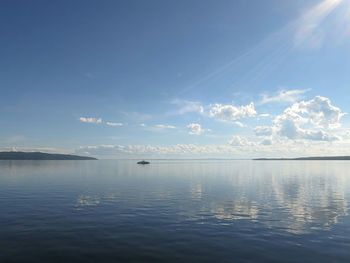 View of calm sea against blue sky