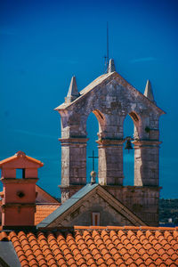 Low angle view of building against blue sky