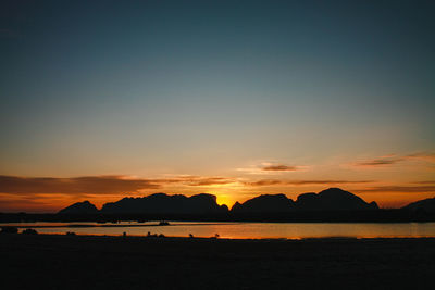 Scenic view of beach against sky during sunset