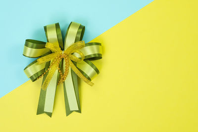 High angle view of umbrella on yellow box