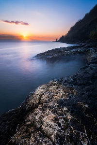 Scenic view of sea against sky during sunset