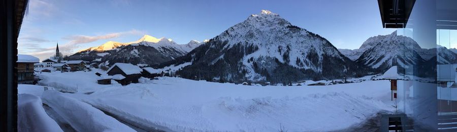 Panoramic view of snowcapped mountains against sky