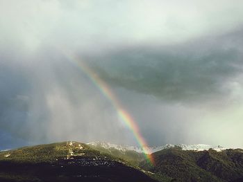 Low angle view of rainbow in sky