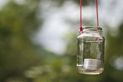 Close-up of a candle in a glass