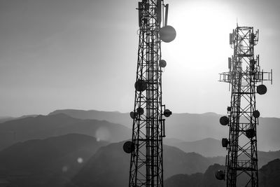 Low angle view of communications tower against sky