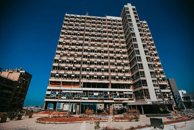 Low angle view of building against blue sky