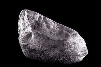 Close-up of rocks against black background