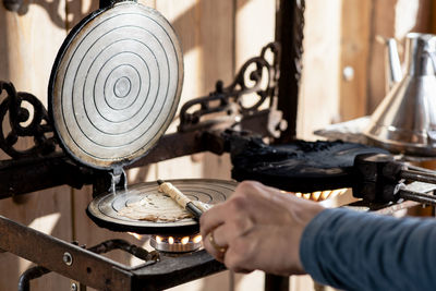 Close up of middle aged man hands cooking homemade artisan pastry