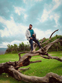 Man standing on tree