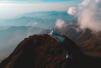 High angle view of mountain range against cloudy sky