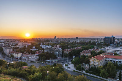 High angle view of buildings against sky during sunset