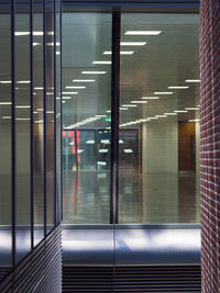 View of railroad station platform seen through window