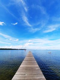 Pier over sea against sky