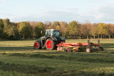 Tractor on field against sky