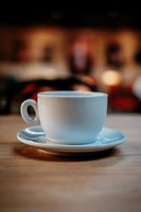 Close-up of coffee cup on table