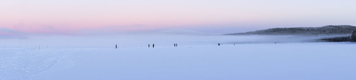 Scenic view of landscape against sky during winter