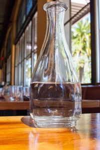 Close-up of water in bottle on table at restaurant