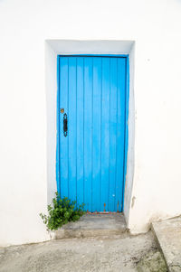 Closed blue door of building