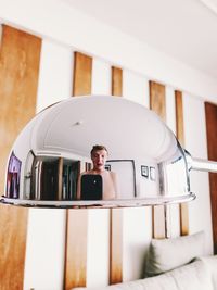 Portrait of man using laptop at home