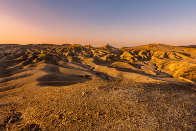 Scenic view of landscape against sky during sunset