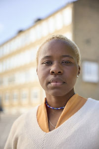 Portrait of thoughtful mature woman standing and looking at camera