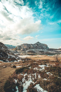 Scenic view of snowcapped mountains against sky