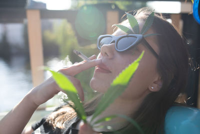 Close-up of woman smoking cigarette