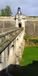 Arch bridge against building