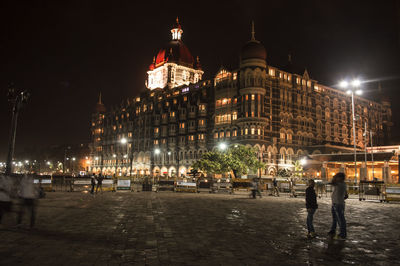 Illuminated buildings in city at night