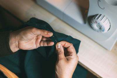 Cropped hand of woman holding hands