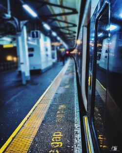 Train at railroad station at night