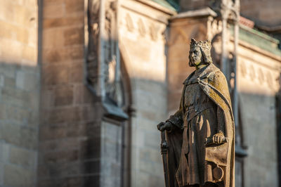 Low angle view of statue against building