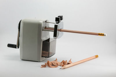 High angle view of meat on table against white background