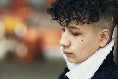 Teenage boy looking away