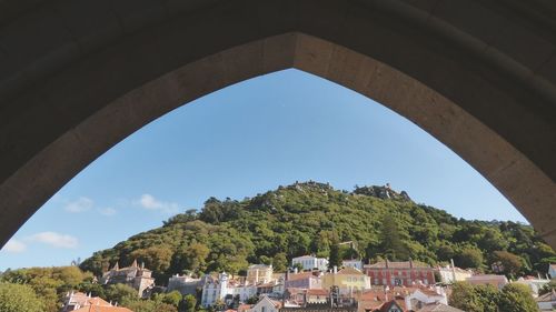 Houses in town against sky