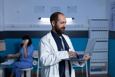 Doctor using laptop in clinic